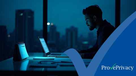 A data protection officer reviewing a year-end GDPR compliance checklist late in the evening, with audit documents and a laptop on the desk